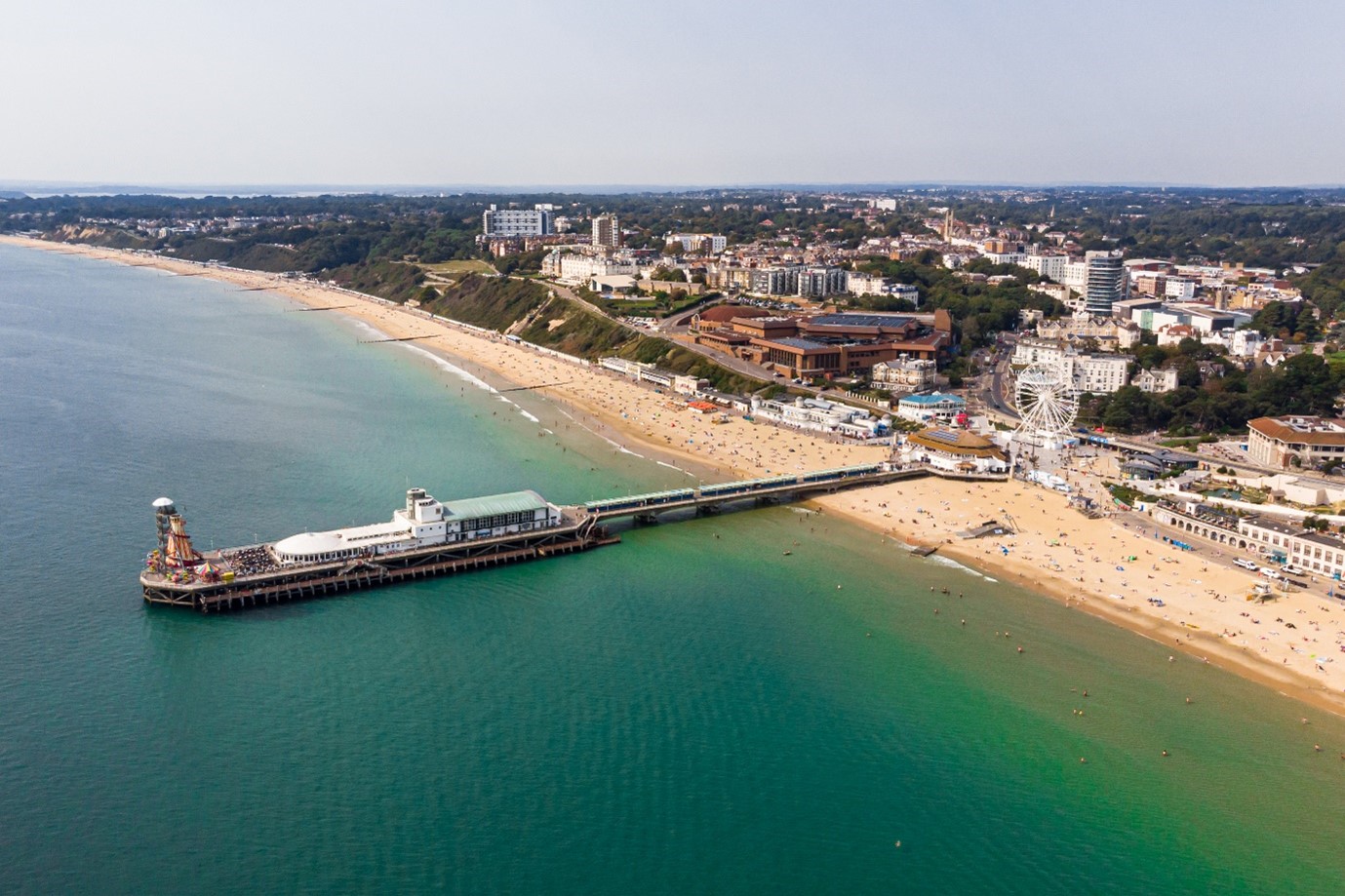 Bournemouth Pier surrounded by the sea from a drones point of view